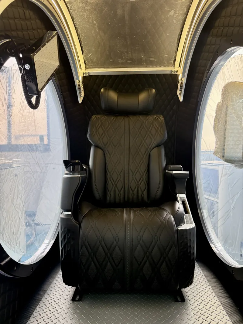 Dark interior with a black quilted seat