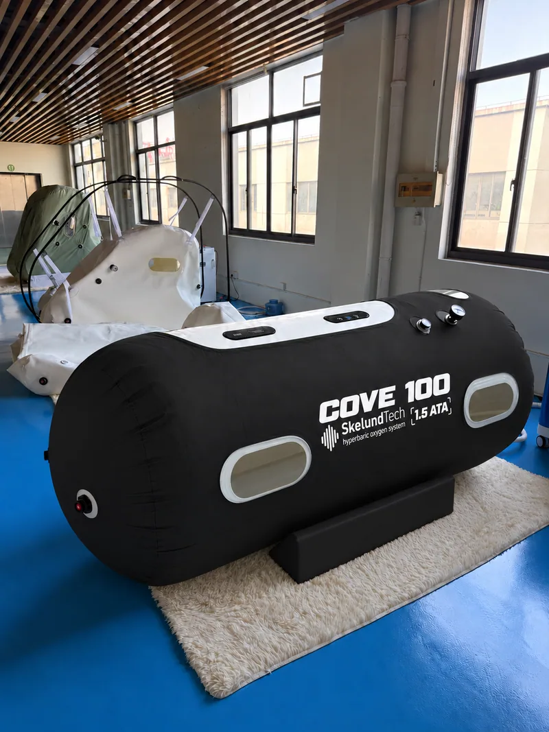 SkelundTech COVE 100 soft hyperbaric chamber, black cover, photographed in the showroom
