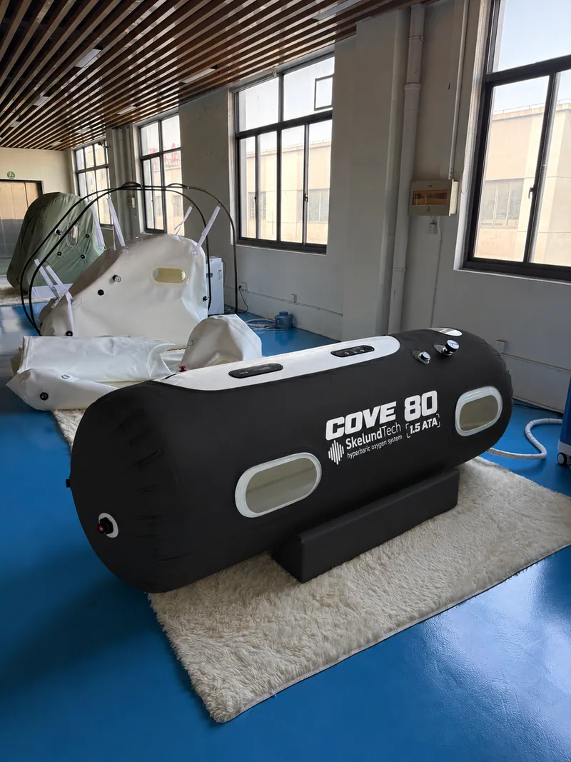 SkelundTech COVE 80 soft hyperbaric chamber, black cover, photographed in the showroom