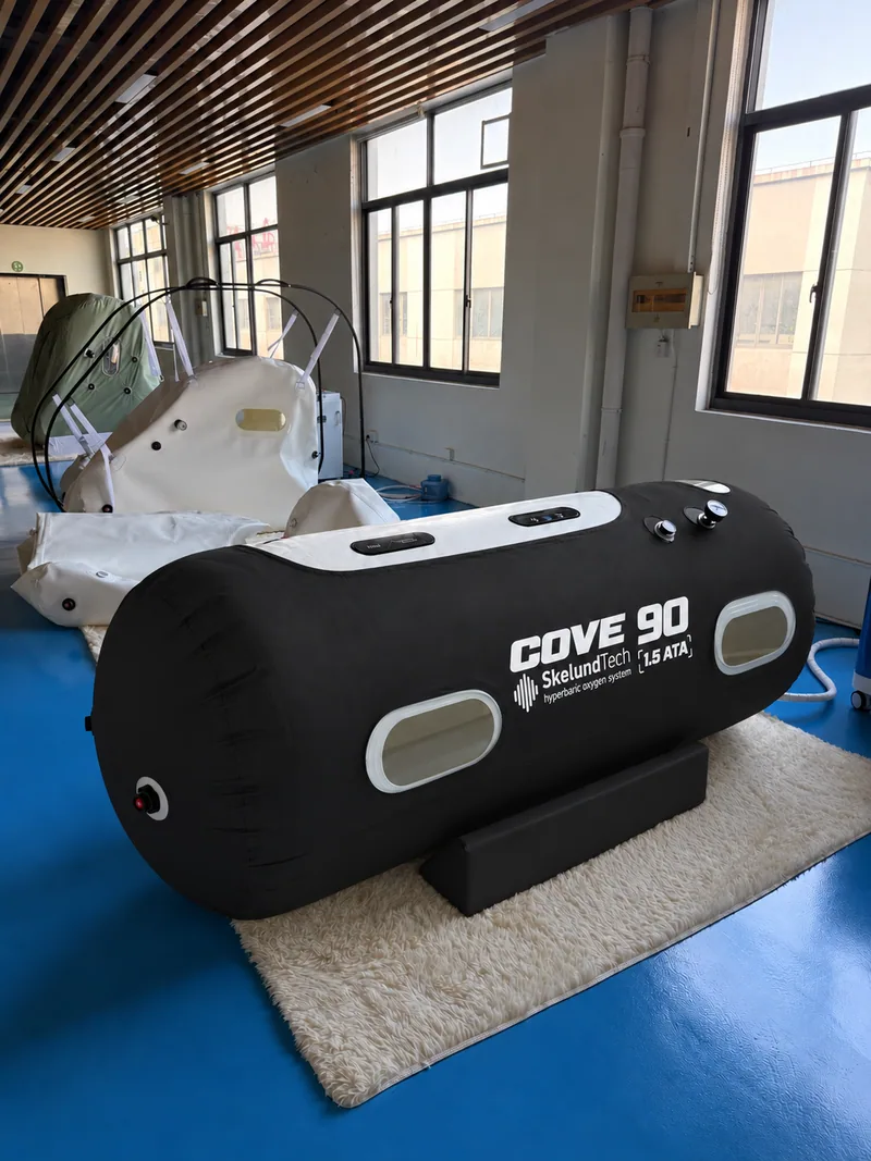SkelundTech COVE 90 soft hyperbaric chamber, black cover, photographed in the showroom